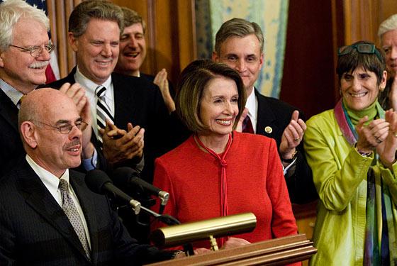 Democratic leaders celebrate the passage of a health care bill in the House of Representatives