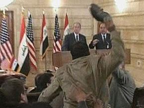 Iraqi journalist Muntader al-Zaidi throws his shoe at George Bush during a press conference
