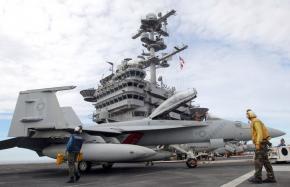 Pilots conduct test flights from the deck of the USS George Washington aircraft carrier off the coast of the Korean Peninsula