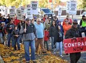 Locked-out Castlewood workers and their supporters march through the streets of Pleasanton, Calif.