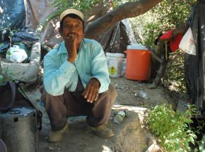 Undocumented immigrants live in a tent village located a few hundred feet from multimillion-dollar homes in suburban San Diego