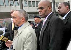 Kenneth Chamberlain Jr. (second from right) listens as lawyers discuss why the officers who killed his father won't be charged