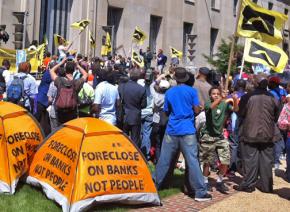 Housing rights activists rally at the Department of Justice in Washington